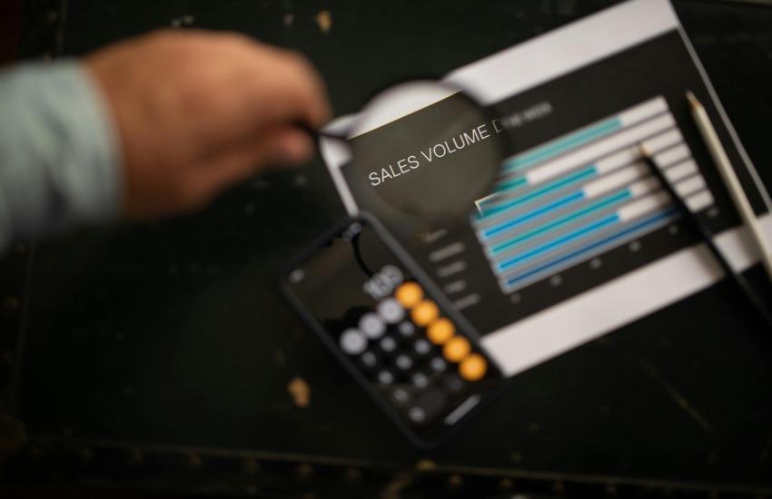 Sales volume highlighted in a magnifying glass